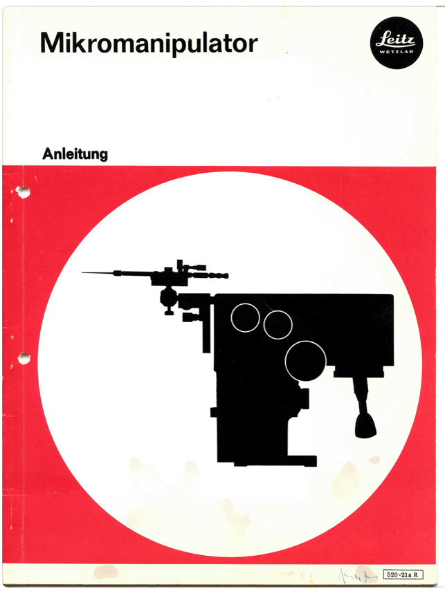 A red and white sign with a black silhouette of a machine
Description automatically generated