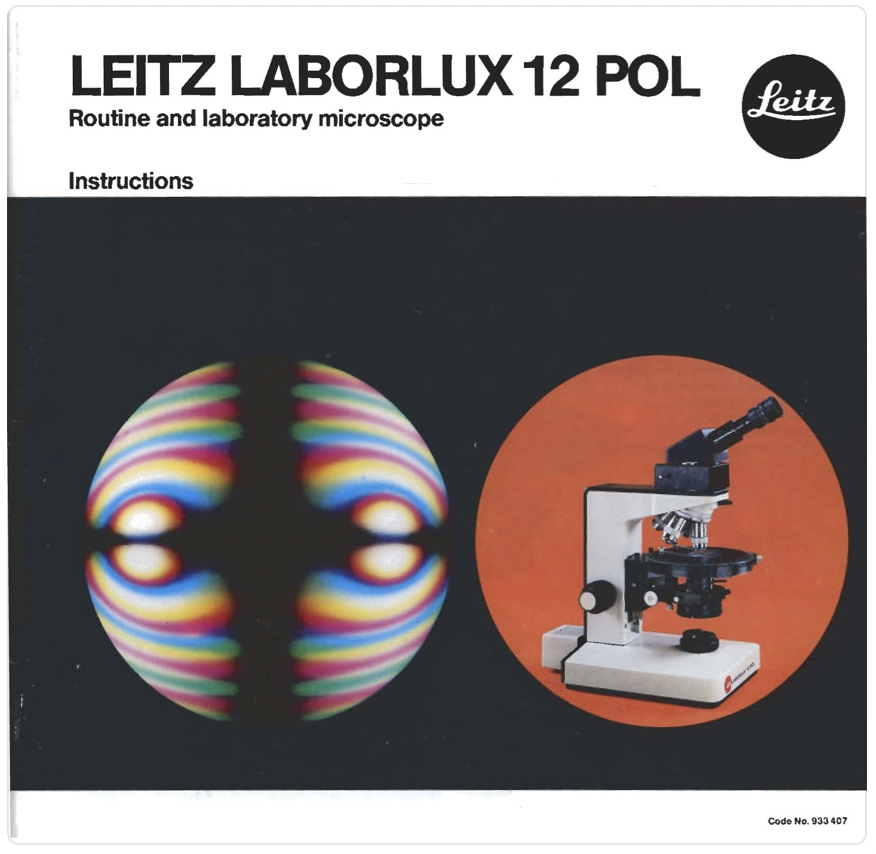 A book cover with a microscope and a circular object
Description automatically generated