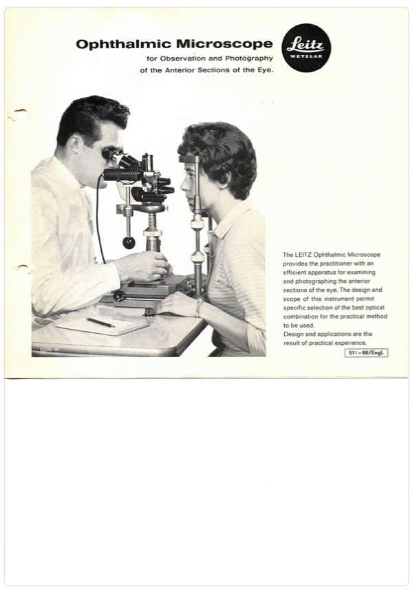 A person and person looking at a microscope
Description automatically generated