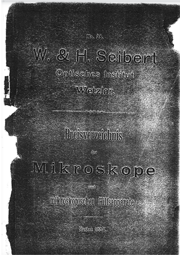 A black and white photo of a book
Description automatically generated
