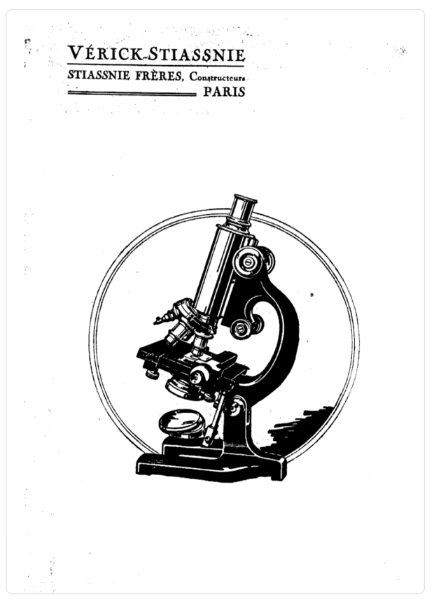 A black and white image of a microscope
Description automatically generated