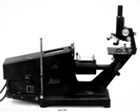 A picture containing machine, microscope, indoor
Description automatically generated