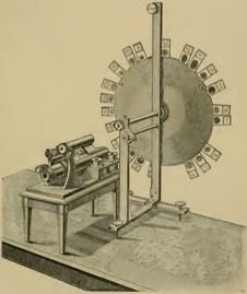 A picture containing indoor, photo, sitting, clock
Description automatically generated