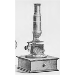 A picture containing old, table, person
Description automatically generated