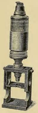 A picture containing indoor, sitting, table, old
Description automatically generated