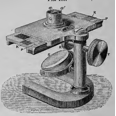 A picture containing table, old, sitting, photo
Description automatically generated
