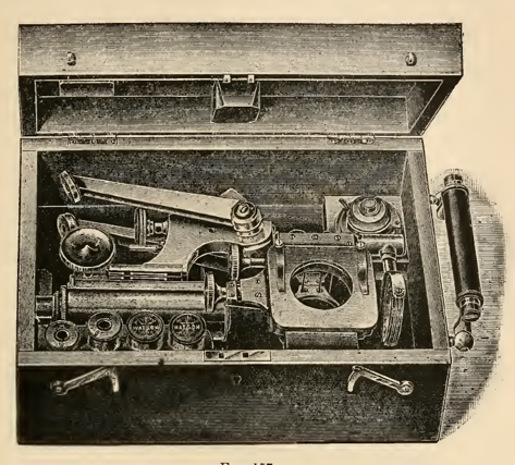 A picture containing old, photo, indoor, sitting
Description automatically generated