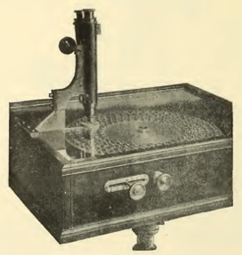 A picture containing sitting, old, photo, suitcase
Description automatically generated