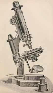 A picture containing object, photo, sitting, person
Description automatically generated