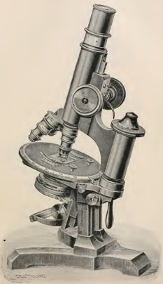 A picture containing object, microscope, indoor, sitting
Description automatically generated