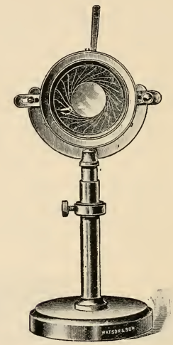A picture containing sitting, clock, table, small
Description automatically generated