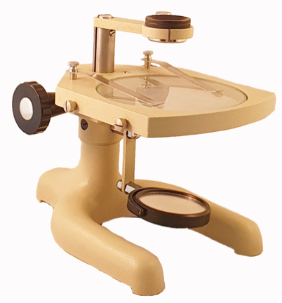 A yellow microscope with a black handleDescription automatically generated
