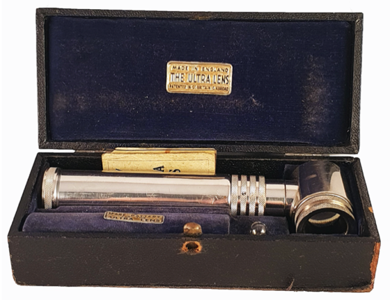 A picture containing case, accessory, old, stack
Description automatically generated